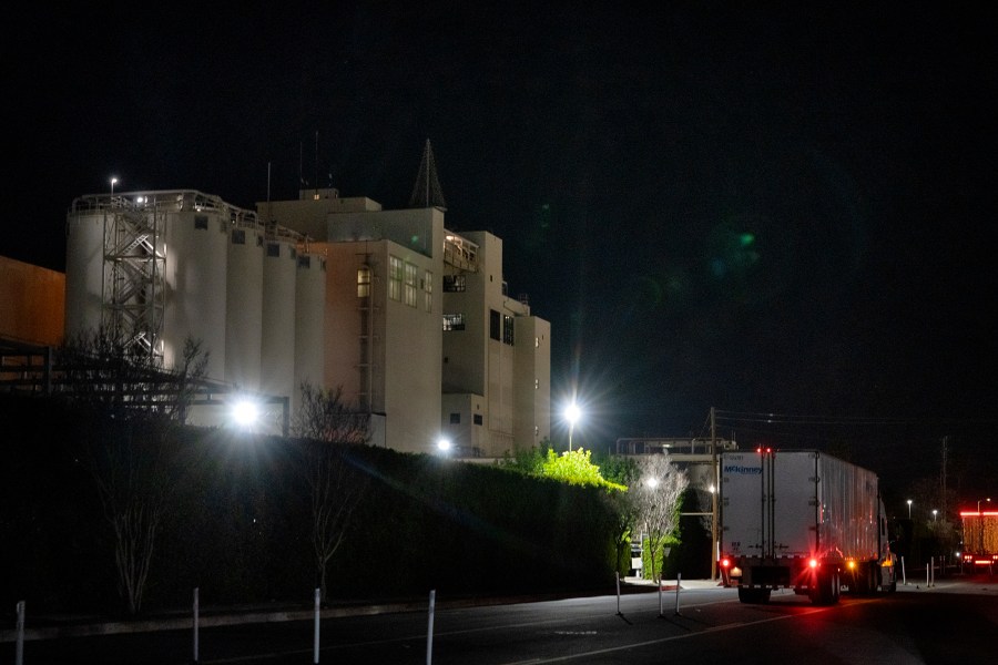 A transport truck waits outside of the Anheuser Busch factory in the Van Nuys section of Los Angeles on Wednesday, Feb. 28, 2024. A standoff between brewery workers and Anheuser-Busch might lead to the first strike by the company's unionized employees in the U.S. since 1976. But fans of Budweiser, Bud Light, Michelob and other beers don't need to worry about going dry. (AP Photo/Richard Vogel)