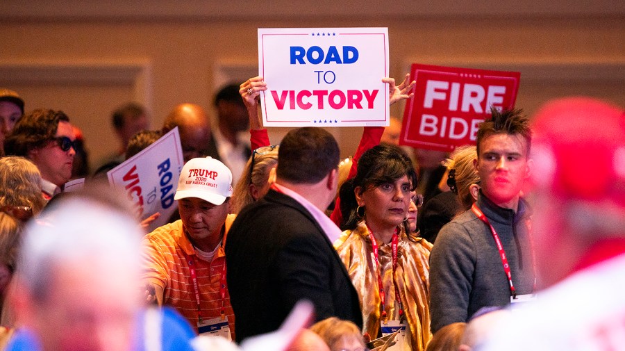 Signs are seen before former President Trump speaks at the Conservative Political Action Conference