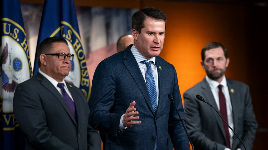 Representative Seth Moulton speaks during a press conference.