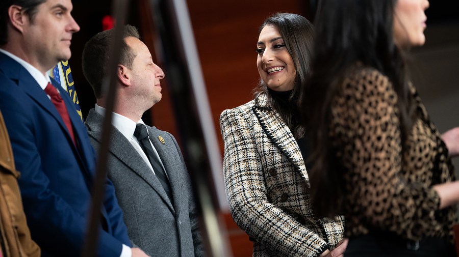 Rep. Jared Moskowitz (D-Fla.) speaks with Rep. Sara Jacobs (D-Calif.)