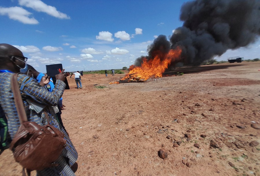 In this photo released by The United Nations Office on Drugs and Crime, shows officials burning seized drugs in Niamey, Niger, Monday, June 26, 2023. Drug seizures soared in the West African Sahel region according to figures released Friday April 19, 2024 in a new U.N. report, indicating the conflict-ridden region is becoming an influential route for drug trafficking. In 2022, 1,466 kilograms, [3,232 pounds], of cocaine were seized in Mali, Chad, Burkina Faso and Niger compared to an average of 13 kilograms [28.7 pounds] between 2013 and 2020 , said the report from the U.N. Office on Drugs and Crime. (UNODC via AP)