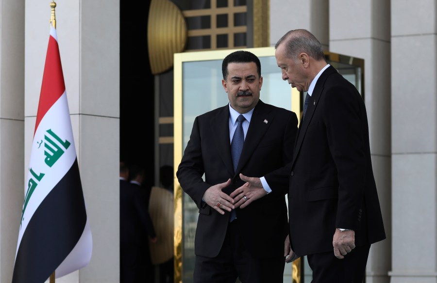 FILE - Turkey's President Recep Tayyip Erdogan, right, and Iraq's Prime Minister Mohammed Shia al-Sudani shake hands during a welcome ceremony in Ankara, Turkey, Tuesday, March 21, 2023. Erdogan was set to make his first official visit to Iraq in more than a decade on Monday April 22, 2024 as his country seeks greater cooperation from Baghdad in its fight against a Kurdish militant group that has a foothold in northern Iraq. (AP Photo/Burhan Ozbilici, File)