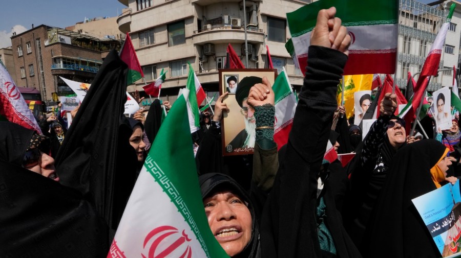 Iranian worshippers chant slogans during an anti-Israeli gathering after their Friday prayer in Tehran, Iran, Friday, April 19, 2024. An apparent Israeli drone attack on Iran saw troops fire air defenses at a major air base and a nuclear site early Friday morning near the central city of Isfahan, an assault coming in retaliation for Tehran's unprecedented drone-and-missile assault on the country.