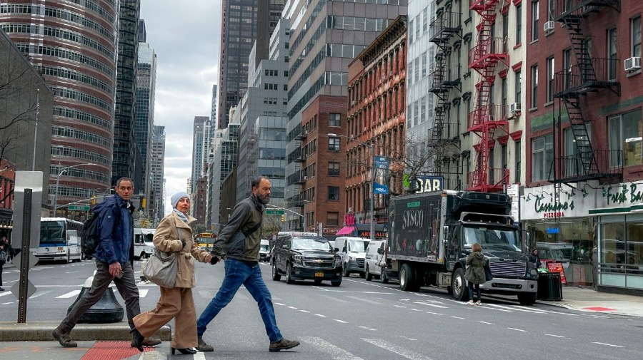 Pedestrians pass along 56th Street in Manhattan after an earthquake was felt along the eastern seaboard of the United States, Friday, April 5, 2024, in New York.