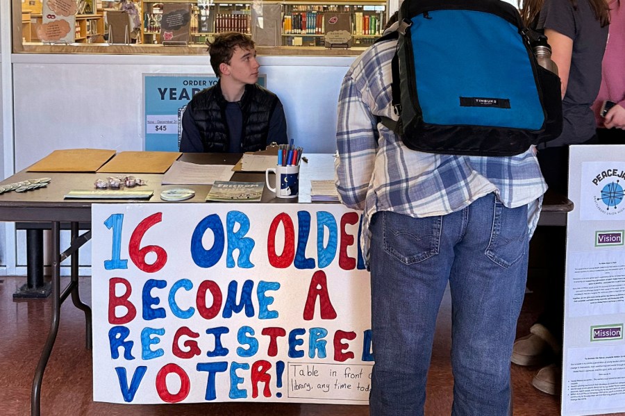 Brattleboro Union High School students register to vote during a voter drive at the school, Feb. 14, 2024, in Brattleboro, Vt.