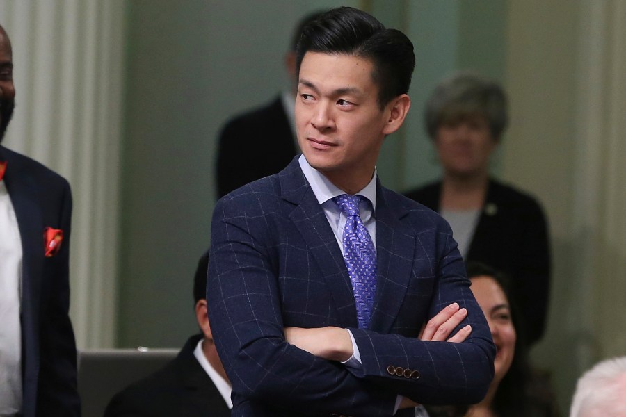 FILE - Assemblyman Evan Low, D-Campbell, watches the debate over a bill during the Assembly session on Aug. 31, 2018, in Sacramento, Calif. Nearly two months after the election, a recount settled the outcome in a Northern California U.S. House primary race, breaking a mathematically improbable tie for second place but leaving questions about why the vote-counting took so long. (AP Photo/Rich Pedroncelli, File)