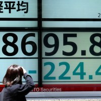 A person looks at an electronic stock board showing Japan's Nikkei 225 index at a securities firm Friday, May 17, 2024, in Tokyo. (AP Photo/Eugene Hoshiko)