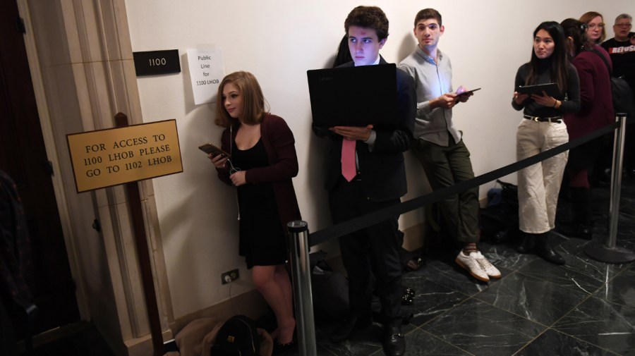 Congressional intern, Sydni Nadler, left, waits in line with others prior to a House Judiciary Committee Impeachment Inquiry hearing at the Longworth House Office Building on Wednesday December 04, 2019 in Washington, D.C.