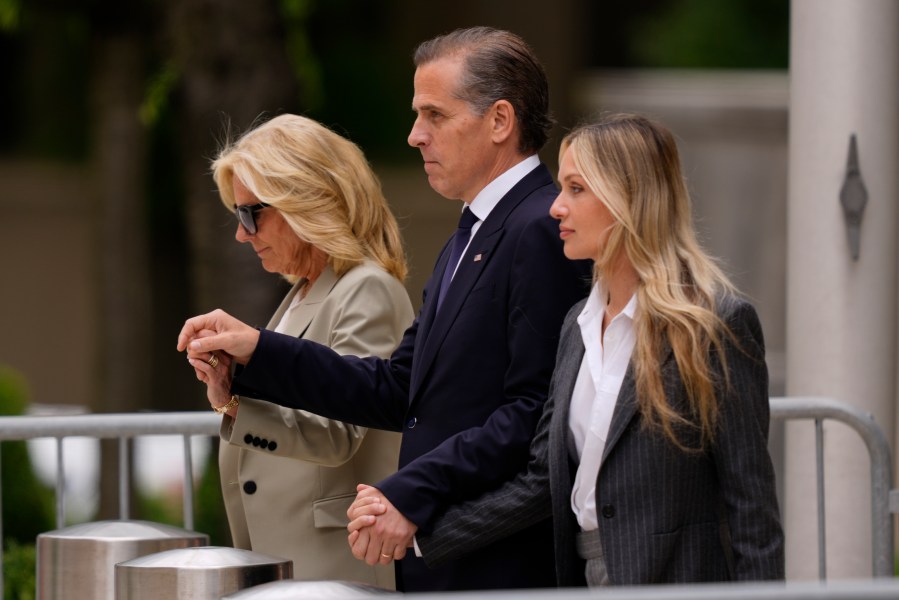 Hunter Biden, center, President Joe Biden's son, accompanied by his mother, first lady Jill Biden, left, and his wife, Melissa Cohen Biden, right, walking out of federal court after hearing the verdict, Tuesday, June 11, 2024, in Wilmington, Del. Hunter Biden has been convicted of all 3 felony charges in the federal gun trial. (AP Photo/Matt Rourke)