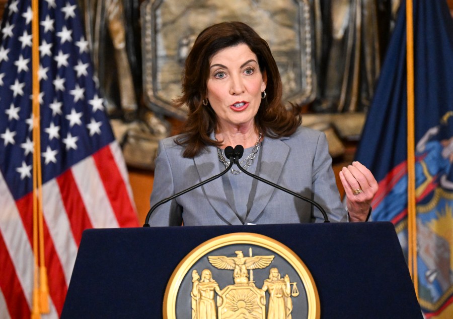 FILE - New York Gov. Kathy Hochul speaks to reporters in the Red Room at the state Capitol, July 1, 2022, in Albany, N.Y. Hochul is considering a ban on face masks in the city subway system, following what she describes as concerns over people shielding their identities while committing antisemitic acts. (AP Photo/Hans Pennink, File)