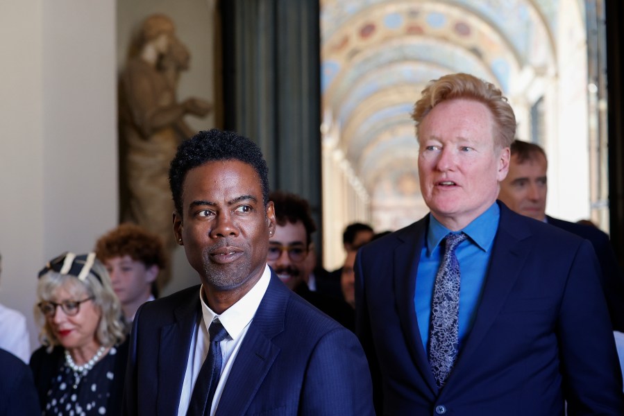Chris Rock, left, and Conan O'Brien arrive for an audience with Pope Francis in the Clementine Hall at The Vatican, Friday, June 14, 2024. Pope Francis is meeting with over 100 comedians from 15 countries aiming to establish a link between the Catholic Church and comic artists. (AP Photo/Riccardo De Luca)