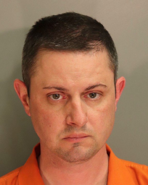 This photo provided by the Montgomery County Detention Center in April 2021, shows Christopher Bauer. On Friday, June 14, 2024, the former FBI agent was convicted of sexually assaulting an 11-year-old girl while serving as an Alabama state trooper — a law enforcement job he landed even after he was kicked out of the FBI amid earlier claims that he raped a co-worker at knifepoint. (Montgomery County Detention Center via AP)