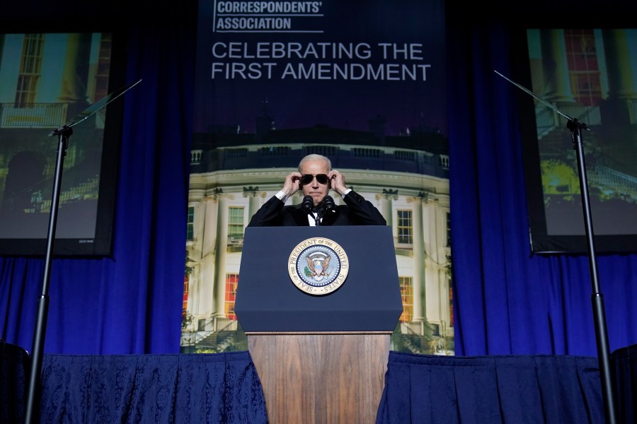 FILE - President Joe Biden puts on sunglasses after making a joke about becoming the "Dark Brandon" persona during the White House Correspondents' Association dinner at the Washington Hilton in Washington, April 29, 2023. Both presidential campaigns this year have embraced digital memes, the lingua franca of social media. (AP Photo/Carolyn Kaster, File)