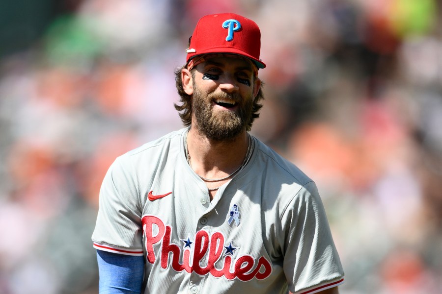 Philadelphia Phillies first baseman Bryce Harper laughs during the seventh inning of a baseball game against the Baltimore Orioles, Sunday, June 16, 2024, in Baltimore. (AP Photo/Nick Wass)