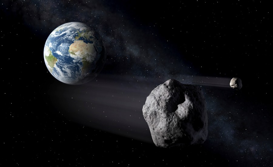 In this artistic rendering, two asteroids fly past Earth. An asteroid will whiz harmlessly past Earth Saturday June 29, 2024. With the right equipment and timing, you just might spot it. Called 2024 MK, the space rock will make its closest approach to Earth at 9:46 AM EST (13:46 GMT) passing by at about three-quarters the distance from Earth to the moon. It was first spotted two weeks ago by South African astronomers and is about 393 feet to 853 feet (120 to 260 meters) wide. (ESA via AP)
