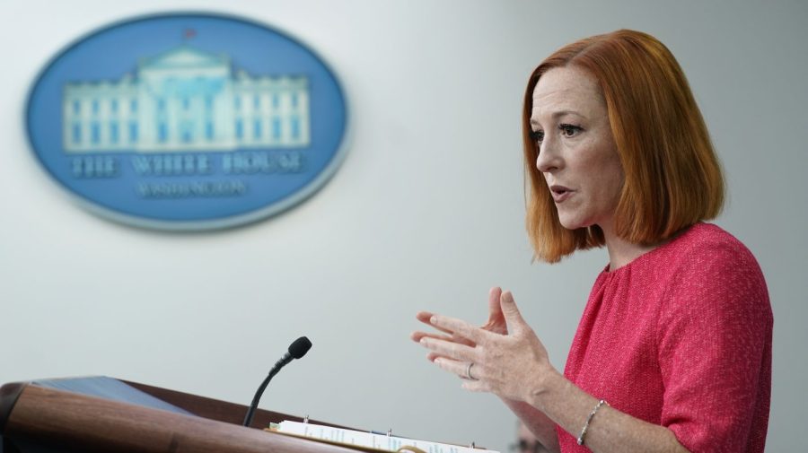 Former White House press secretary Jen Psaki is seen in profile as she delivers a briefing.