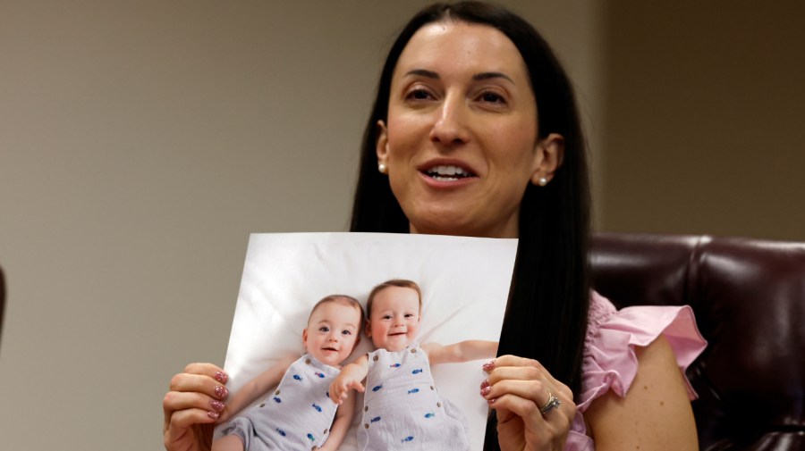 Julie Cohen proudly shows off her twins Gideon and Levi who were born thanks to IVF as Secretary of U.S. Health and Human Services, Xavier Becerra hosts a panel discussion with families directly affected by the Alabama Supreme Court Court decision, Tuesday, Feb. 27, 2024, in Birmingham, Ala. (AP Photo/ Butch Dill)