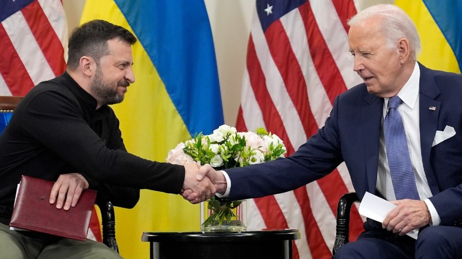 U.S. President Joe Biden shakes hands with Ukrainian President Volodymyr Zelenskyy in Paris, Friday, June 7, 2024.