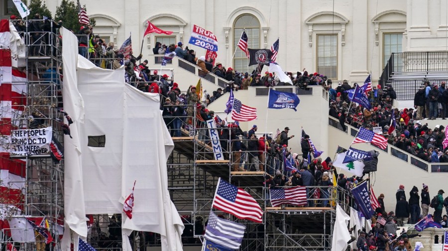 FILE - In this Jan. 6, 2021 file photo insurrectionists loyal to President Donald Trump riot outside the Capitol in Washington.