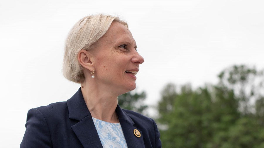 Representative Victoria Spartz looks off to the side outside the Capitol.