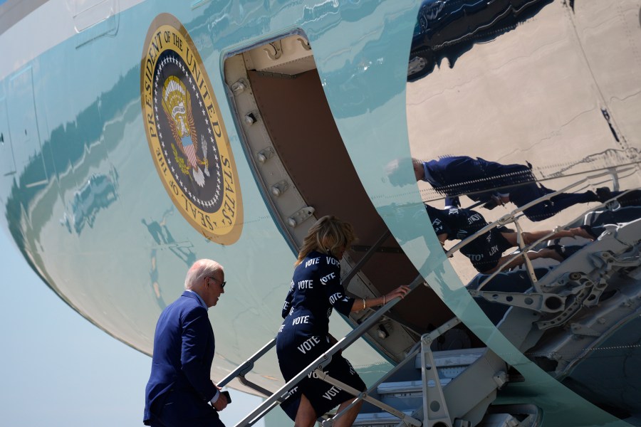 President Joe Biden, left, and first lady Jill Biden board Air Force One at Raleigh-Durham International Airport, Friday, June 28, 2024, in Raleigh, N.C. (AP Photo/Evan Vucci)