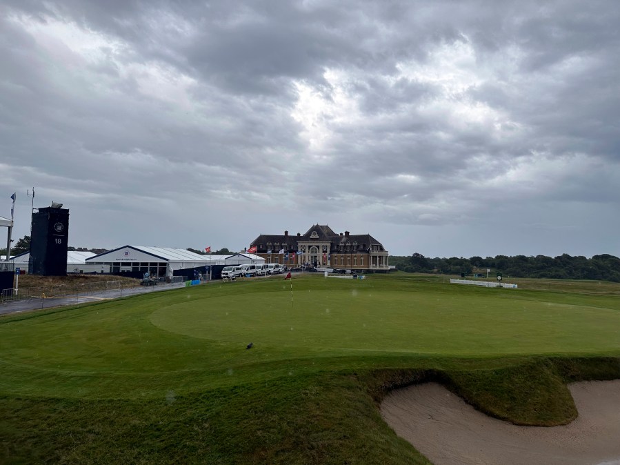 Rain falls on the clubhouse at Newport Country Club, Sunday, June 30, 2024, in Newport, R.I., during the U.S. Senior Open golf tournament. The final round was suspended due to the rain. (AP Photo/Chris Lehourites)