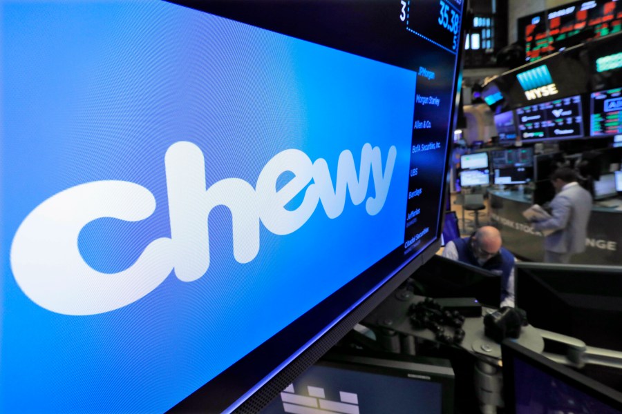 FILE - The logo for Chewy appears above trading posts on the floor of the New York Stock Exchange, June 14, 2019. Shares for Chewy jumped in premarket trading early Monday, July 1, 2024, after a regulatory filing disclosed that Roaring Kitty, an investor at the center of the meme stock craze, had taken a 6.6% stake in the online pet retailer. (AP Photo/Richard Drew, File)