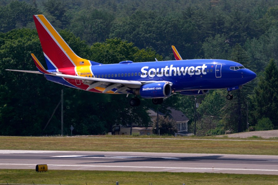 FILE - Southwest Airlines Boeing 737 lands at Manchester Boston Regional Airport, June 2, 2023, in Manchester, N.H. Southwest Airlines has adopted a ‘poison pill’ following activist investor Elliott Investment Management taking a significant stake in the company. The airline said Wednesday, July 3, 2024, that the shareholder rights plan is effective immediately and expires in a year. For any extension to occur, Southwest shareholders would need to give prior approval.(AP Photo/Charles Krupa, File)