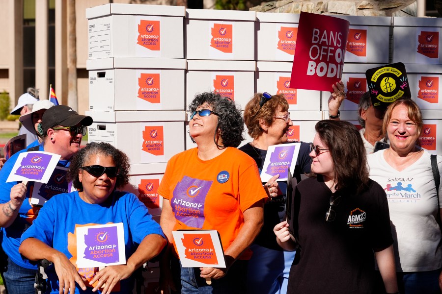 Arizona abortion-rights supporters gather for a news conference prior to delivering over 800,000 petition signatures to the capitol to get abortion rights on the November general election ballot Wednesday, July 3, 2024, in Phoenix. (AP Photo/Ross D. Franklin)