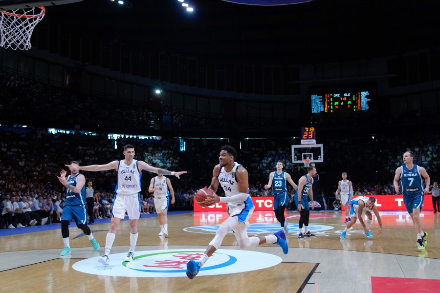 Greece's Giannis Antetokounmpo advances with the ball during an Acropolis tournament basketball match against Slovenia, at the Peace and Friendship indoor stadium at Athens' port city of Piraeus, Saturday, July 6, 2024. (AP Photo/Petros Giannakouris)