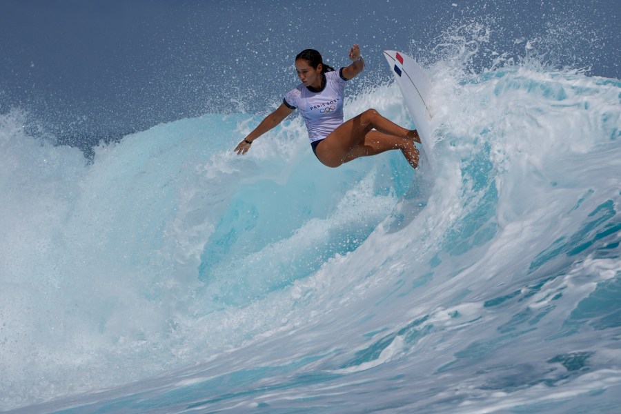 Vahine Fierro, of France, surfs on a training day ahead of the 2024 Summer Olympics surfing competition Thursday, July 25, 2024, in Teahupo'o, Tahiti. (AP Photo/Gregory Bull)