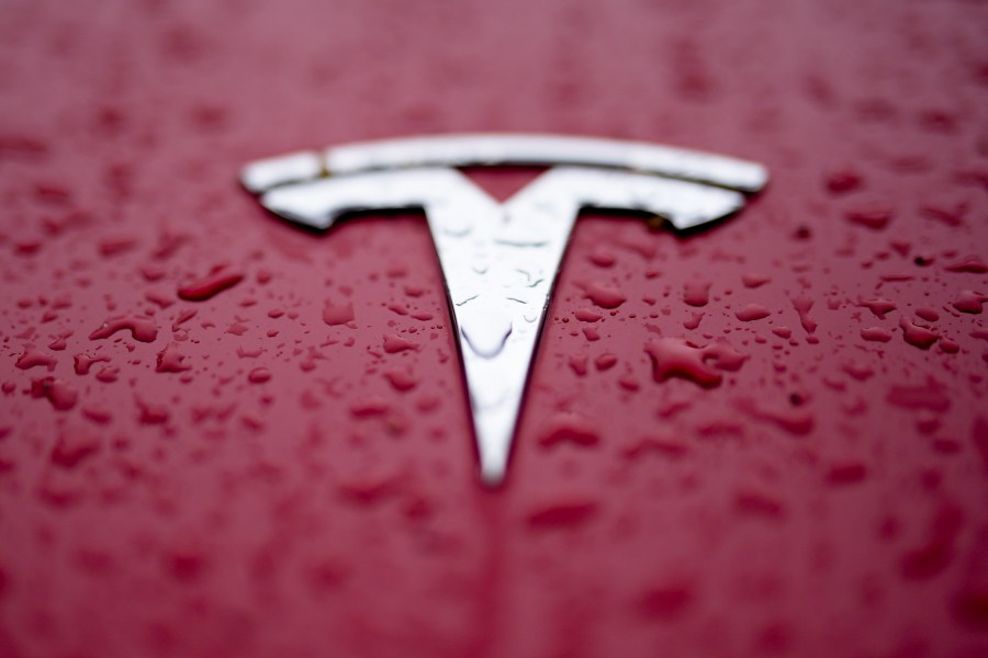 FILE - A Tesla logo is shown on Feb. 27, 2024, in Charlotte, N.C. Authorities in Washington announced Tuesday, July 30 that the Tesla that hit and killed a motorcyclist near Seattle in April was operating on the company’s “Full Self Driving” system. (AP Photo/Chris Carlson, File)