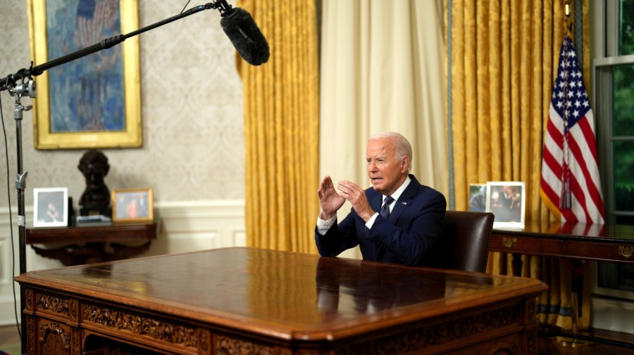 US President Joe Biden delivers a prime-time address to the nation in the Oval Office of the White House in Washington, DC, US, on Sunday, July 14, 2024. The stakes in this election are high and it's time to cool down the political rhetoric, President Joe Biden said in an address from Oval Office. Photographer: Erin Schaff/The New York Times/Bloomberg via Getty Images