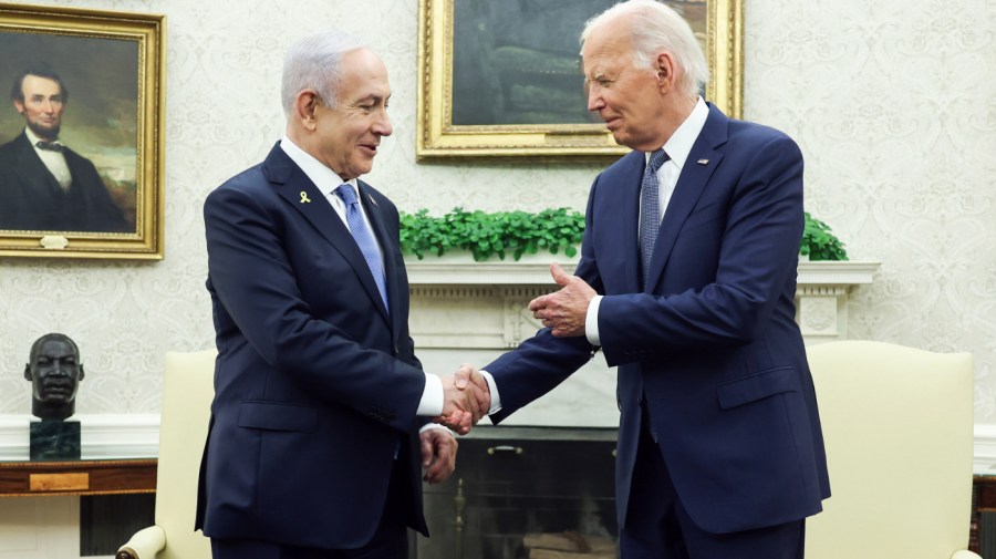 US President Joe Biden, right, and Benjamin Netanyahu, Israel's prime minister, shake hands during a bilateral meeting in the Oval Office of the White House in Washington, DC, US, on Thursday, July 25, 2024. Netanyahu gave a fiery defense of Israel's war against Hamas in a speech to the US Congress on Wednesday, inserting himself into a super-charged moment in American politics and mocking thousands of demonstrators outside protesting his handling of the conflict in Gaza. Photographer: Samuel Corum/Sipa/Bloomberg via Getty Images