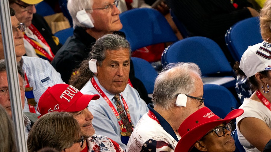 Delegates from Arizona wear bandages similar to former President Trump's during the Republican National Convention