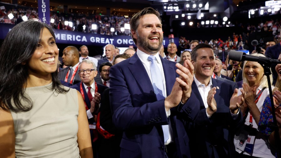 U.S. Sen. J.D. Vance (R-OH) and his wife Usha Chilukuri Vance celebrate as he is nominated for the office of Vice President alongside Ohio Delegate Bernie Moreno on the first day of the Republican National Convention at the Fiserv Forum on July 15, 2024 in Milwaukee, Wisconsin. Delegates, politicians, and the Republican faithful are in Milwaukee for the annual convention, concluding with former President Donald Trump accepting his party's presidential nomination. The RNC takes place from July 15-18. (Photo by Anna Moneymaker/Getty Images)