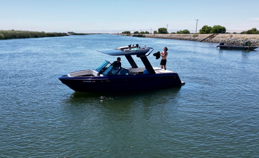 An electric sports boat made by California-based Arc Boats floats on the Sacramento-San Joaquin Delta near Bethel Island, Calif. on Wednesday, July 31, 2024. (AP Photo/Terry Chea)