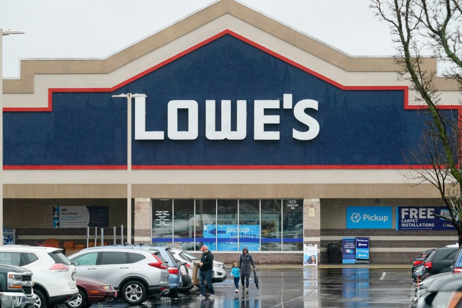 FILE - Shoppers exit a Lowe's in Warrington, Pa., Feb. 4, 2022. (AP Photo/Matt Rourke, File)