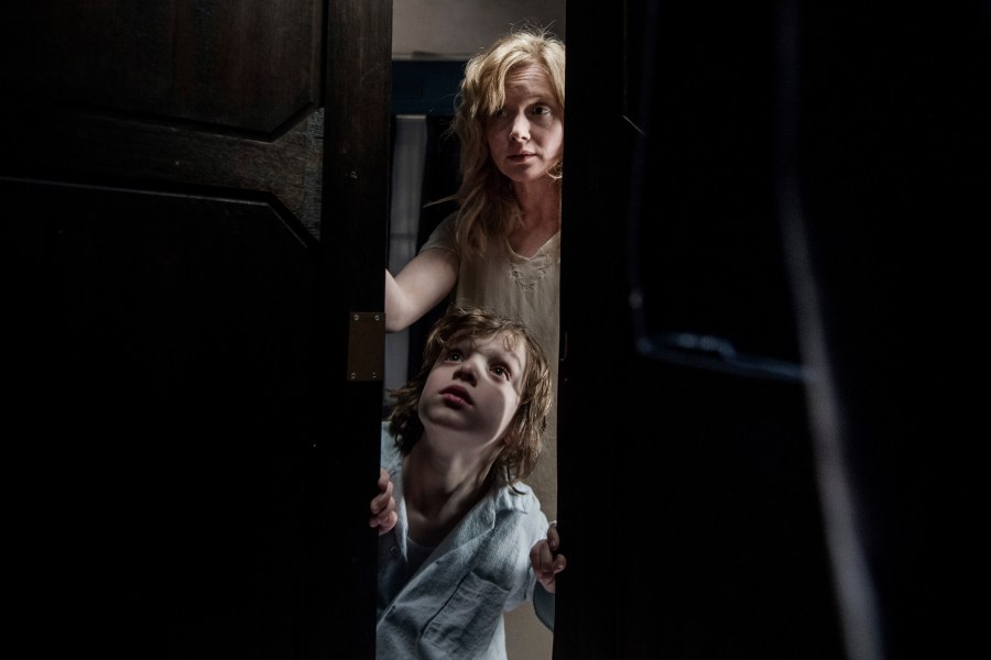 This image released by IFC Films shows Noah Wiseman, bottom, and Essie Davis in a scene from the film "The Babadook." (IFC Films via AP)