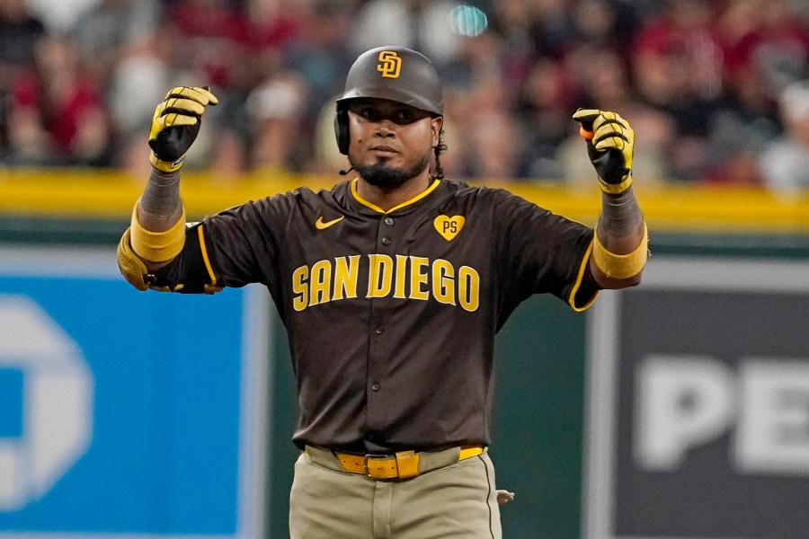 San Diego Padres' Luis Arraez celebrates after his double against the Arizona Diamondbacks during the sixth inning of a baseball game, Sunday, Sept. 29, 2024, in Phoenix. (AP Photo/Darryl Webb)