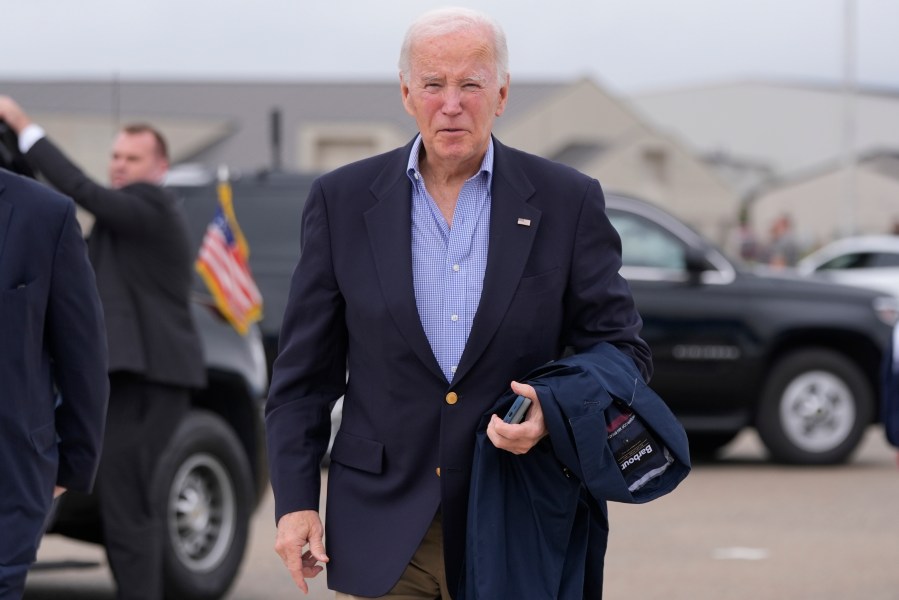 President Joe Biden speaks to reporters before boarding Air Force One at Dover Air Force Base, in Dover, Del., Sunday, Sept. 29, 2024, to return to Washington. (AP Photo/Manuel Balce Ceneta)