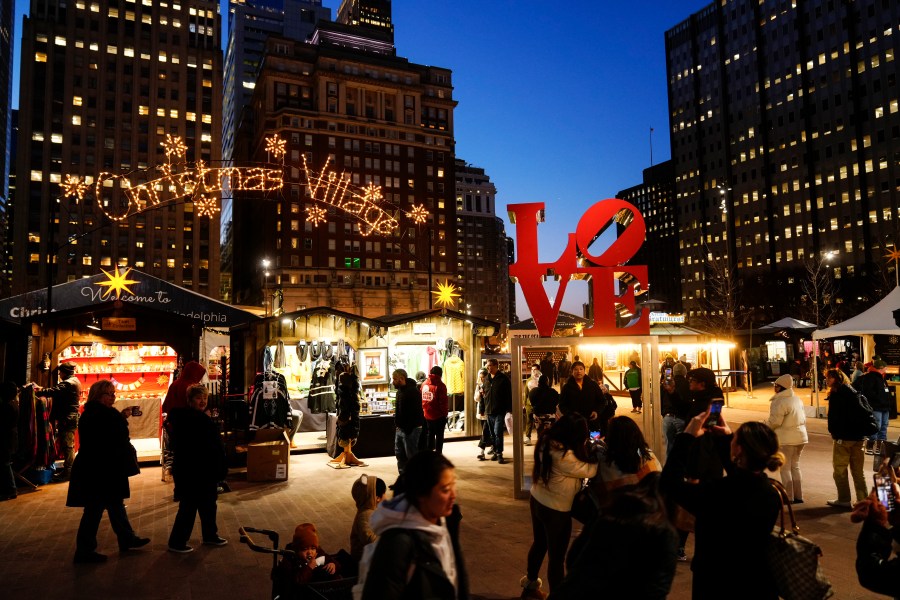 FILE - Shoppers visit the Christmas Village in Philadelphia, Dec. 13, 2023. (AP Photo/Matt Rourke, File)