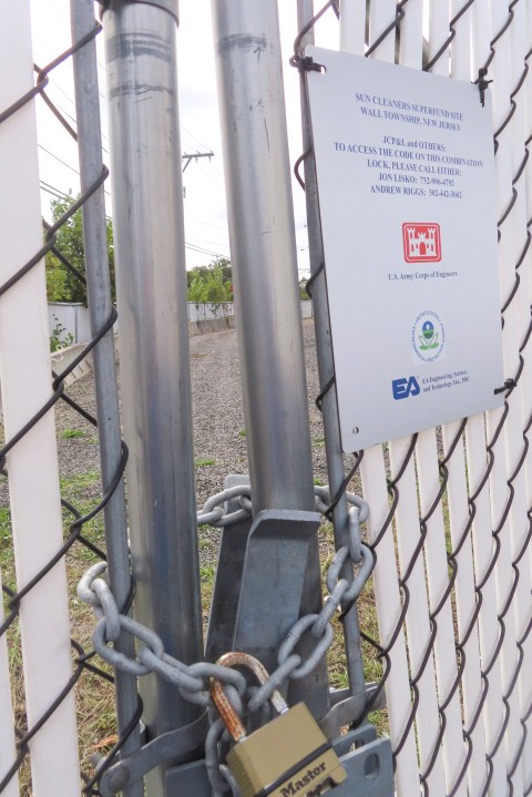 A padlock protects a polluted site in Wall Township, N.J., that could be disturbed by digging for an offshore wind power cable, Sept. 30, 2024. (AP Photo/Wayne Parry)