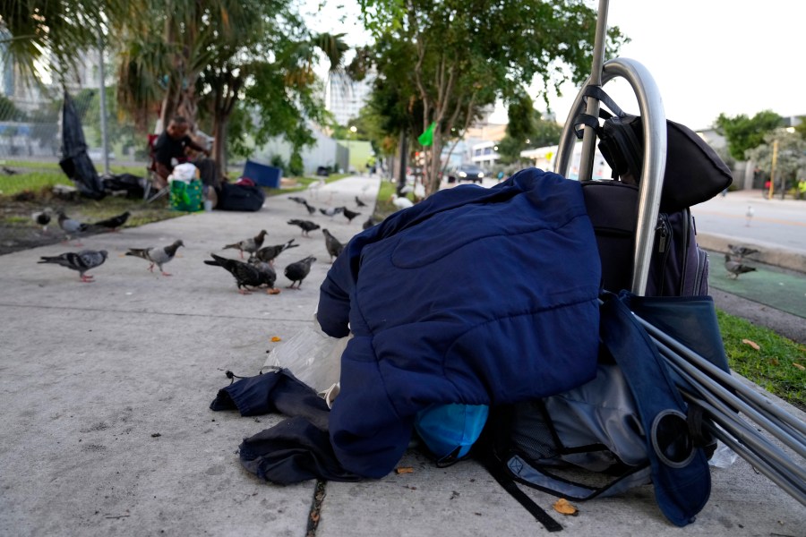 The belongings of a homeless person are piled on the sidewalk on the first day of a statute that took effect, making it illegal in Florida to sleep on sidewalks, in parks, on beaches or in other public spaces — one of the country's strictest anti-homelessness laws, Tuesday, Oct. 1, 2024, in Fort Lauderdale, Fla. (AP Photo/Lynne Sladky)