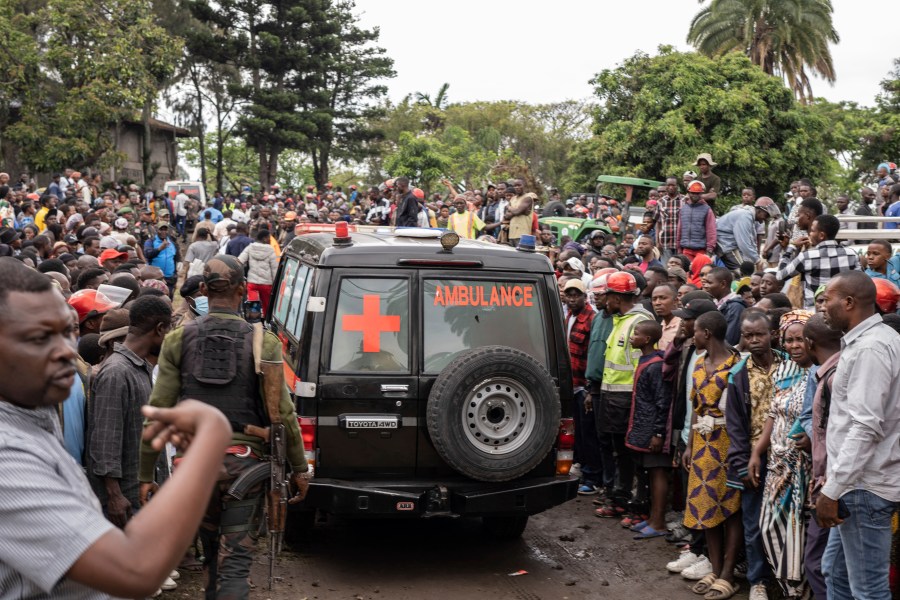 An ambulance carries victims away from the port of Goma, Democratic Republic of Congo, after a ferry carrying hundreds capsized on arrival Thursday, Oct. 3, 2024. (AP Photo/Moses Sawasawa)