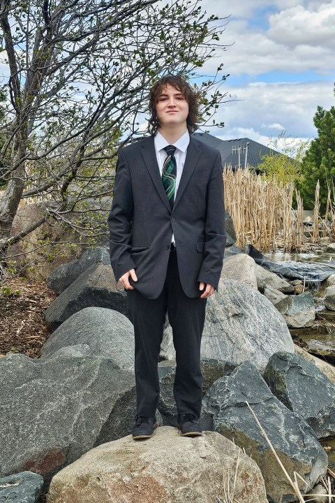 This photo provided by Catherine Dutcher shows Sam Dutcher dressed for prom in West Fargo, N.D., May 4, 2024. (Catherine Dutcher via AP)