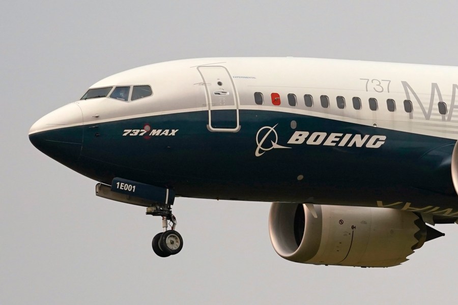 FILE - A Boeing 737 Max jet prepares to land at Boeing Field following a test flight in Seattle, Sept. 30, 2020. Two U.S. senators have asked the Department of Justice to take tougher action against Boeing executives by holding them criminally accountable for safety issues that have impacted its airplanes, Thursday, Oct. 3, 2024. (AP Photo/Elaine Thompson, File)