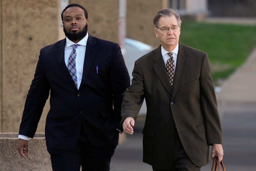 Demetrius Haley, left, one of three former Memphis police officers charged in the 2023 fatal beating of Tyre Nichols, arrives at the federal courthouse with his attorney Michael Stengel, right, for the day's proceedings Thursday, Oct. 3, 2024, in Memphis, Tenn. (AP Photo/George Walker IV)