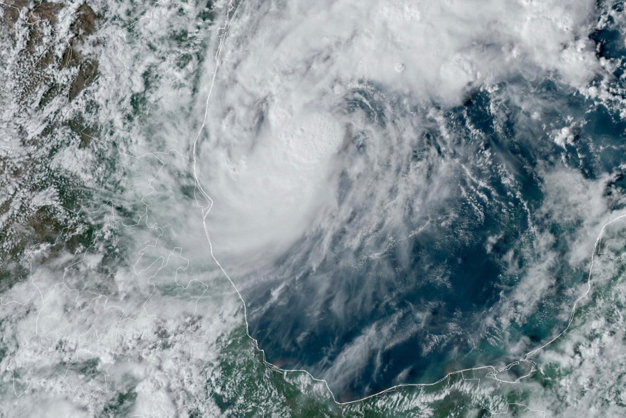 This GOES-16 GeoColor satellite image taken at 4:50 p.m. EDT and provided by National Oceanic and Atmospheric Administration (NOAA) shows Tropical Storm Milton, center, off the coast of Mexico in the Gulf of Mexico, Saturday, Oct. 5, 2024. (NOAA via AP)