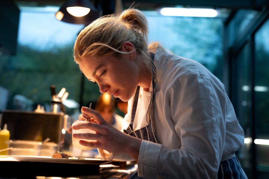 This image released by A24 shows Florence Pugh in a scene from "We Live In Time." (Peter Mountain/A24 via AP)